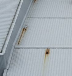 Close-up of water ingress on commercial facade cladding